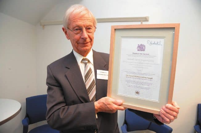 The framed Queen's Award for Voluntary Service certificate